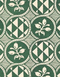 a green and white pattern with flowers on it