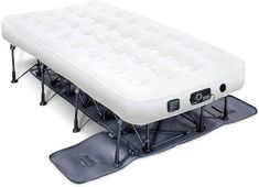 an inflatable mattress is sitting on top of a snowboard