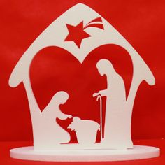 a paper cut nativity scene depicting the birth of jesus and baby jesus in a manger