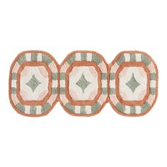 three circles with green and white designs on the front, one has an orange center