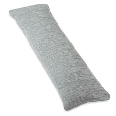 a gray pillow sitting on top of a white floor