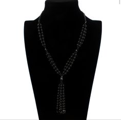 The perfect black beaded necklace. There’s no clasp to break or to hook. There’s a continuous beaded necklace finished with an eye catching tassel. Susan Black, Pearl Sweater, Black Beaded Necklace, Black Bead Necklace, Sweater Chain, Flower Hair Accessories, Seamless Bra, Necklace Black, Fashion Accessories Jewelry