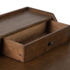 a wooden drawer with two drawers on top of it and one drawer open to show the contents