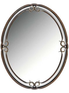 a round mirror with an ornate design on the top and bottom edge, is shown against a white background