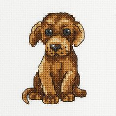 a cross stitch dog is sitting down with its eyes wide open and it's head turned to the side