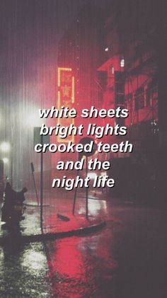 the words white sheets bright lights crooked teeth and the night life are written in black