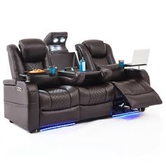 two reclining chairs with laptop on the table