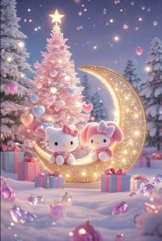 two hello kitty dolls sitting on top of a crescent in front of a christmas tree