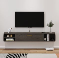 a flat screen tv mounted to the side of a wall