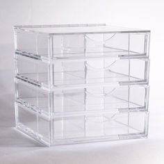 four clear drawers stacked on top of each other