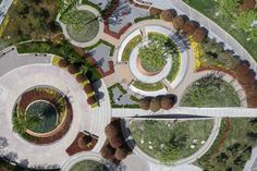 an aerial view of a circular park with trees and bushes in the center, surrounded by concrete walkways