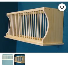 a wooden shelf mounted to the side of a wall next to a blue wall with a heart on it