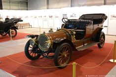 an antique car is on display at the museum