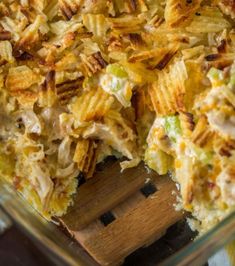 a casserole dish filled with chicken and cheese