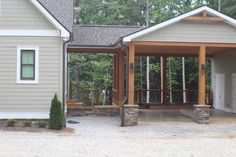 a house with a covered porch in the front yard