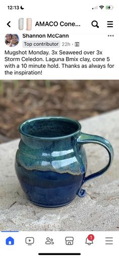 a blue mug sitting on top of a table next to an email message that reads,