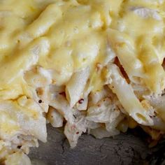 a casserole dish with chicken and cheese on top