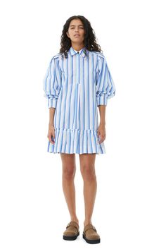 This Blue Striped Cotton Mini Shirt Dress is designed for a regular fit and features a collar, button closure, curved sleeves with pleated shoulders, ruffle hemline and a striped print. GANNI Blue Striped Cotton Mini Shirt Dress in Silver Lake Blue | Women's Size 6 Blue Cotton Long Sleeve Mini Dress, Blue Collared Cotton Mini Dress, Chic Striped Cotton Mini Dress, Ganni Mini Dress, Ganni Blue Dress, Ganni Dress, Size 12 Women, Size 16 Women, Size 10 Women