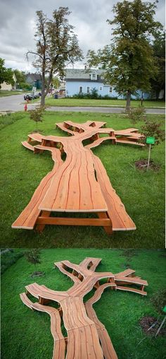 a wooden bench sitting on top of a lush green field