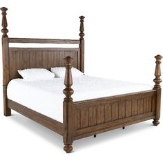 a wooden bed frame with four posts and white sheets on the bottom, against a white background