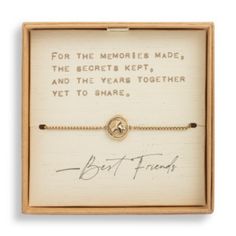 a bracelet in a wooden box with writing on the front and bottom, which reads for the memories made, the secrets kept and the years together yet to share