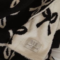 a black and white blanket with an animal design on it