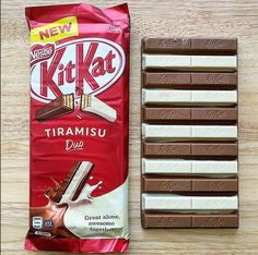 the kitkat chocolate bar is next to it's wrapper