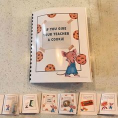 an open book with pictures of cookies and mouses on it next to matching cards