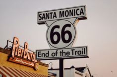 a street sign for santa monica and the end of the trail