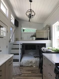 a small kitchen and living area in a tiny home