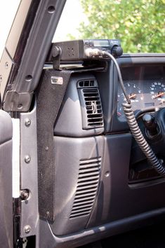 the interior of a vehicle with an electronic device hooked up to it