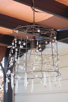 a chandelier hanging from a wooden roof