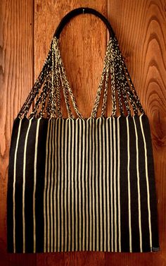 This unique handwoven market tote bag from Mexico was made on a traditional Maya loom- combining ancient weaving techniques with a modern design. It is a perfect gift, gift bag, or addition to your wardrobe. The beige and black stripes make this a bag that can be combined with many different outfits, and it looks great with a neutral outfit.  Spot clean with soap and water using cloth. Air dry only! Black Bohemian Crochet Bag Handwoven, Eco-friendly Woven Beach Bag For Travel, Traditional Black Rectangular Crochet Bag, Artisan Handwoven Shoulder Bag For Everyday, Weaved Tote Beach Bag For Travel, Woven Tote Beach Bag For Travel, Traditional Black Woven Crochet Bag, Traditional Handwoven Shoulder Bag For Everyday, Summer Beach Bag With Weaving For Everyday Use