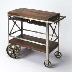 a wooden and metal cart with wheels on the bottom is shown in front of a white background