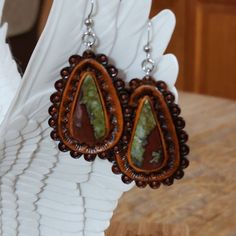 Hand picked unique cut gemstones pieces to make these standout one of a kind leather earrings.  -Your choice of Bloodstone and different variations of Turquoise  -Surgical Steel hooks -Stainless steel bails -Doubled leather -Briar brown finished  Find more of my rustic my hand made designs ## https://www.etsy.com/shop/KCsDesignsShop $ this site has coupon codes -message for any questions you may have Buffalo Nickel, Western Leather, Oyster Shell, Leather Cuffs, Ear Wire, Make Design, Turquoise Gemstone, Leather Earrings, Leather Tooling