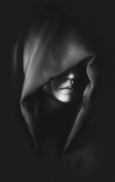 a black and white photo of a woman's face covered by a blanket in the dark