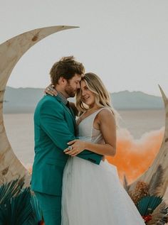 dry-lake-bed-las-vegas-las-vegas-elopement-nevada-smoke-bombs-nevada-elopement-photography-photographer-silhouettes-reclamation-design-dress-night-photography-elopement-desert-desert-elopement-inspiration-celestial-flowers-half-moon-arch-golden-hour-sunset-teal-suit-teal-orange-couple-wedding-dress-pahrump-styled-wedding-styled-elopement Moon Arch Wedding, Moon Wedding Arch, Oasis Wedding