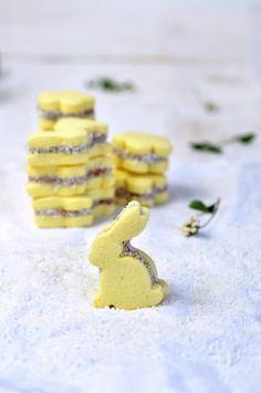 small yellow desserts sitting on top of a white table