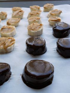 chocolate covered pastries sitting on top of a white table