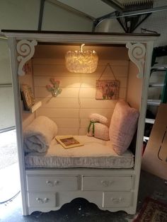 an old dresser is turned into a bed