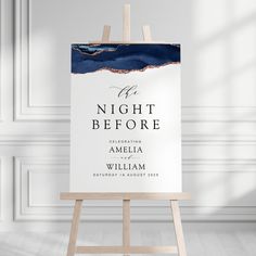 an easel stands in front of a white wall with the words night before on it