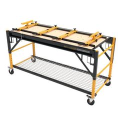 a workbench with two trays on it and wheels attached to the top