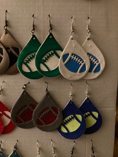 Light weight Faux Leather Football shaped earrings. Your favorite Teams, in your Favorite Colors. Each set sold separately. Volleyball Faux Leather Earrings, Leather Earring Patterns Free, Diy School Spirit Crafts, Football Earrings Cricut, Faux Leather Earrings Cricut Svg Free, Cricut Earrings Diy, Faux Leather Projects, Cricut Leather Earrings, Leather Earrings Cricut