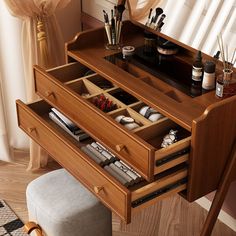 a wooden desk with drawers and various items in it