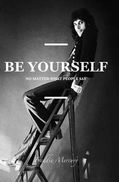 a black and white photo of a woman sitting on top of a chair with the words be yourself