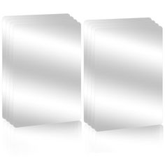 two white square mirrors on a white surface with reflections in them, one is empty and the other has no image