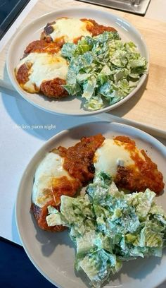 two white plates topped with different types of food