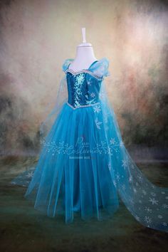 the dress is blue and has white stars on it