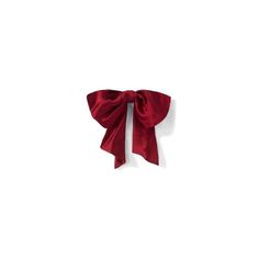 a red bow tied on top of a white wall