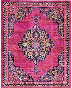 a pink rug with an ornate design on the middle and bottom, in different colors